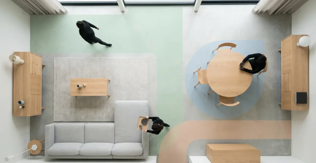 Vue de dessus d'un salon montrant les largeurs de passages optimales entre les meubles